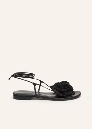 Wrap around flat flower sandals in black crochet